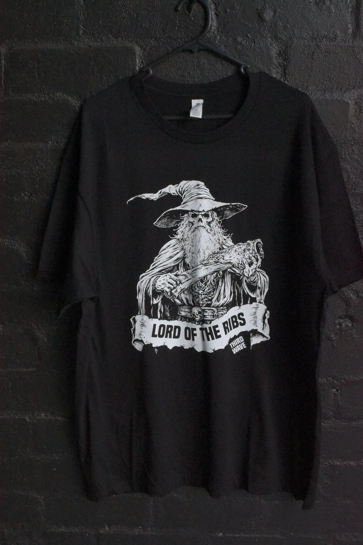 Third Wave Lord of the Ribs screen print on black tee against brick wall